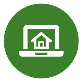 White computer with a house on the screen icon on green background