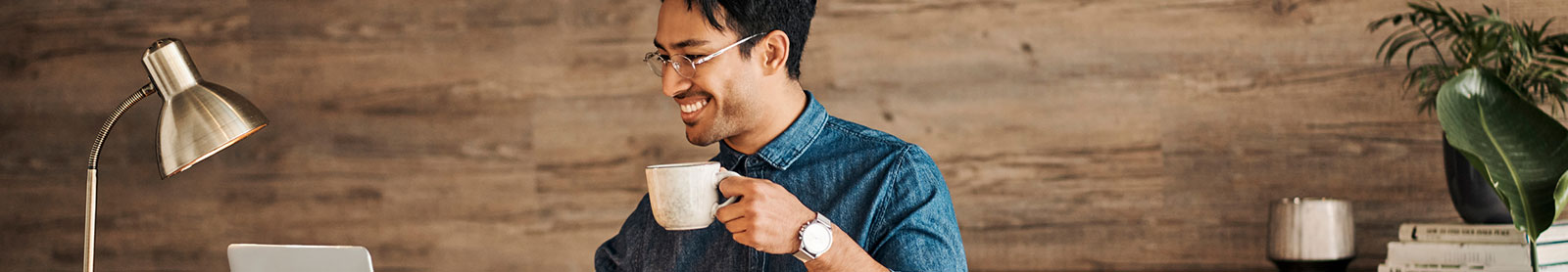 Man using laptop in home office
